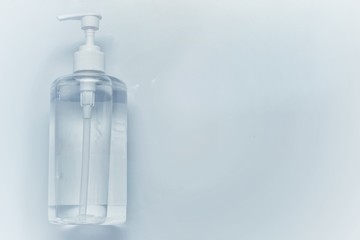 medical mask and hand sanitizer bottle with white background