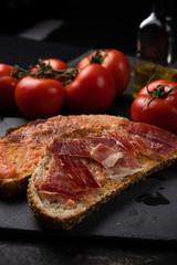 toast with ham oil and tomato