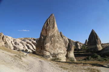 View of valley and rock formations in Cappadocia Turkey. Tuff volcanic cliffs and sandstone hills...