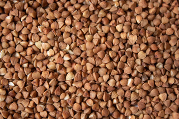 Background of scattered raw buckwheat