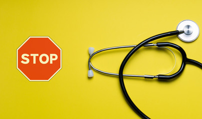 Stop covid 19. Black stethoscope for doctor diagnostic coronavirus disease, medical tool for health on black background with copy space. Phonendoscope . stethoscope
on color background.