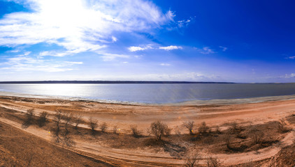 panorama of a lake with blue sky