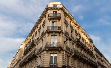 Traditional French house with typical balconies and windows. Paris.