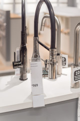 Faucets with in chrome plated at kitchen showroom in furniture store near Dallas, Texas, USA