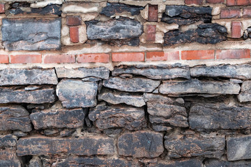 Old Stone Wall Reinforced with Brick