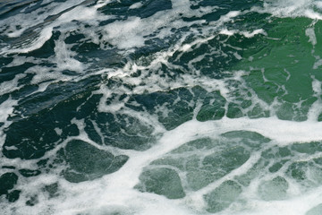 Fototapeta na wymiar Green sea clean transparent water splash texture background