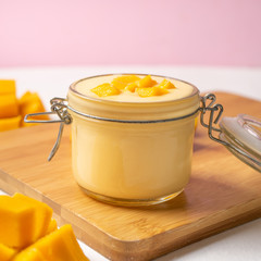 Mango yogurt on pink background