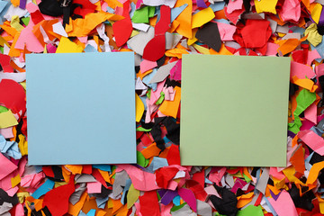 Two blank stickers with place for text on the background of torn colored paper