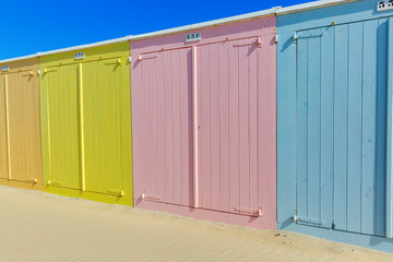 row of colorful beach huts