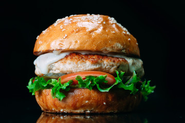 Juicy beef Burger on a black background.