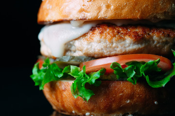 Juicy beef Burger on a black background.