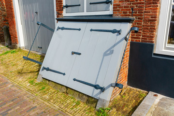antique coal cellar door in Veere, Netherlands