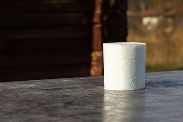 wooden background in retro style on it lined with pyrimide toilet paper