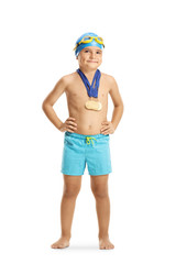 Boy swimming champion posing with his medals