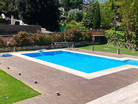 View of swimming pool in home lawn , swimming pool in home is amazing  addition in home decoration.