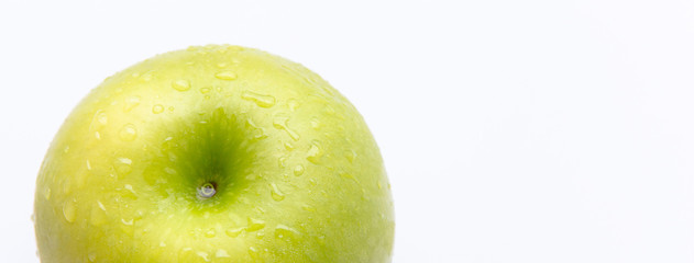Juicy green apple with drops of water, horizontal banner with a place for text