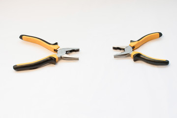 A black and yellow hand pliers copy spase on white