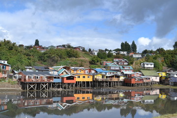 Fototapeta na wymiar houses on the river, Palafitos in Chiloé, Chile