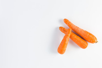 Group of three carrots isolated on white background