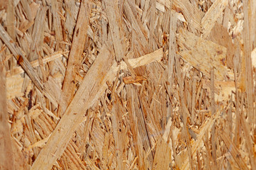 Texture of OSB oriented chipboard. Material for the construction of frame houses
