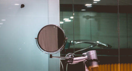 Fototapeta na wymiar magnifying mirror on the sink in the bathroom of a hotel