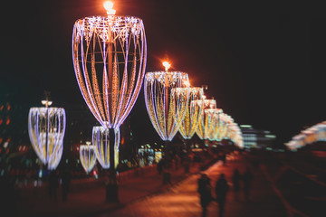 Moscow streets with New Year decoration, Christmas illumination on the Red Square, with Christmas market fair, with Saint Basil's Cathedral, Russia