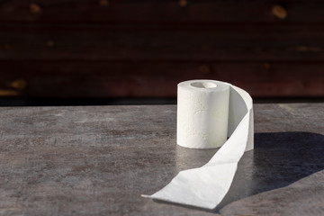 wooden background in retro style on it lined with pyrimide toilet paper