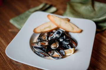grilled mussels with garlic on table