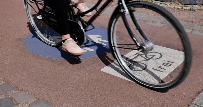 Selected focus view at bicycle with FREI means Free and people symbol on pedestrian and bicycle lane with cyclist ride bicycle in Germany Cycling friendly city in Ecityurope. 