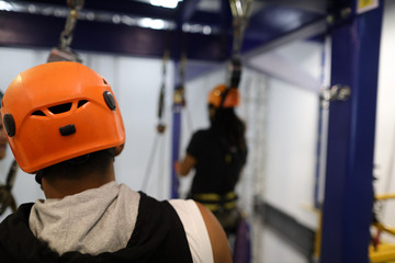 Safe work practices rope access supervisor wearing yellow safety hard hat keeping eyes on...
