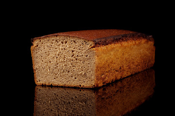 Loaf of dark rye bread isolated