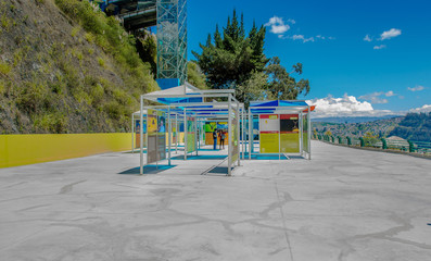 QUITO, ECUADOR, FEBRUARY 02, 2018: Outdoor view of informative adversisements in plastic structures of Yaku museum of water located in the city of Quito, with the city buildings in the horizont