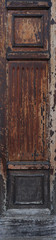 ancient worn out texture of wood with ornaments in a decorative vertical panel, with squares and lines carved - background with a retro texture