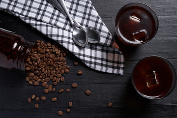 Cold brew coffee on a black wood