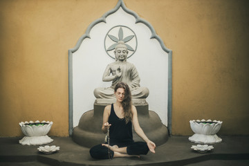 the woman meditating by mudra-youga