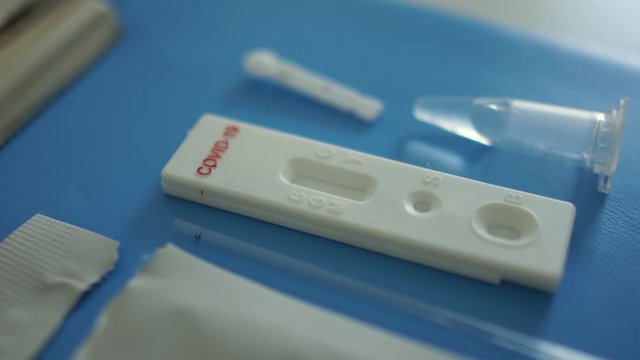 Unpacked test cassette for conducting rapid test Covid-19. Set for blood sampling and diagnosis of coronosirus SARS-CoV-2
