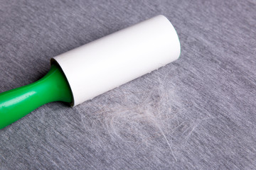 Roller for cleaning clothes from wool, wool on clothes
