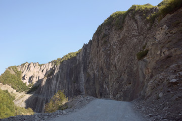 Mountainous road leading to Lahic village in Ismayilli region of Azerbaijan, with car.