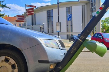 Crumpled front car was demolished by an accident bump into a power pole. Damaged and broken...