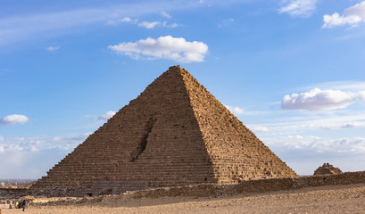 Cairo, Giza, Pyramid of Menkaure (Mykerinos, Menkheres), Egypt. Pyramid on the background of the evening cloudy sky.