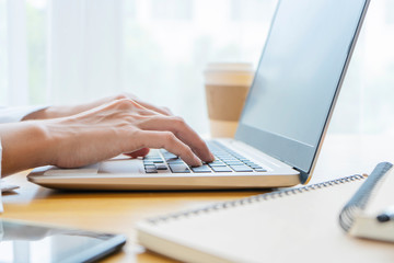 Close-up of a business man's hand using a laptop