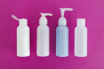 skincare and beauty,  group of moisturizers bottles and toner lotionson pink background