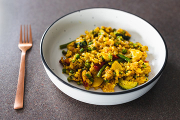 plant-based food, vegan turmeric and cumin potato scramble with mediterraneand veggies and peas