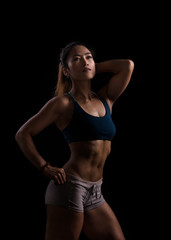 Sporty woman workout while Cropped studio shot of a stunning hot sporty body of a fitness woman
