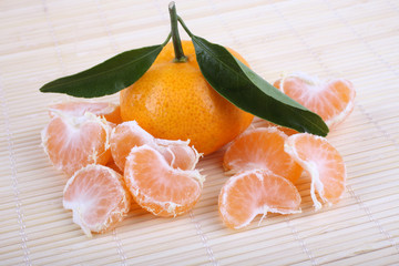 Mandarin oranges on bamboo background