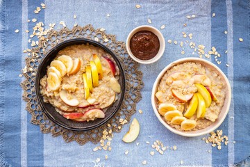Oatmeal porridge with fruits. Apples and bananas. Vegan food breakfast
