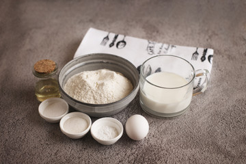  Flour, milk, spices and butter on the general background