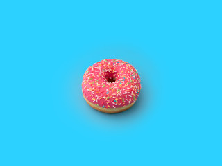 pink doughnut with multicolored sprinkles in the center of the frame on a blue background