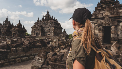 Tourist backpacker exploring Plaosan temple in Java island, Indonesia