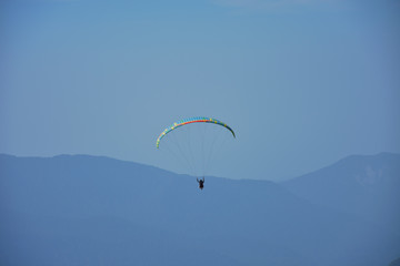 paragliding in the blue sky